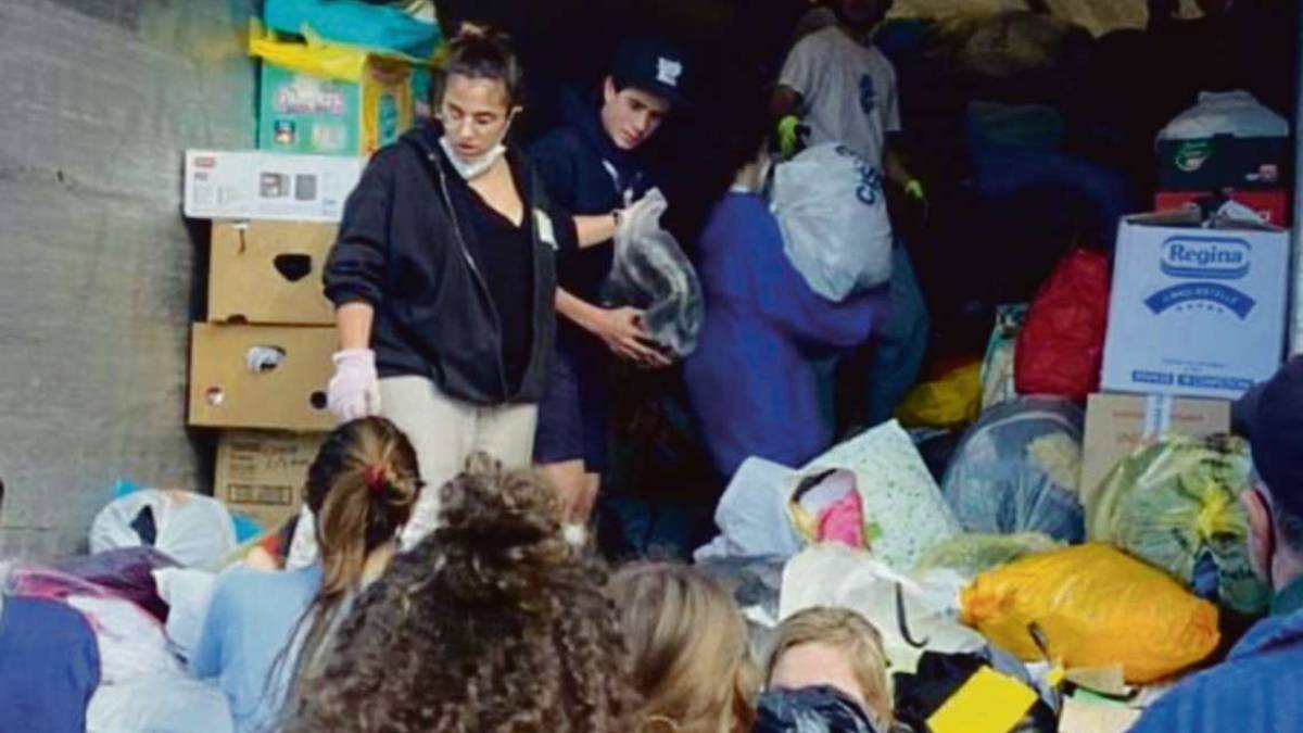 Rimini. Campo lavoro, il vescovo tra i volontari