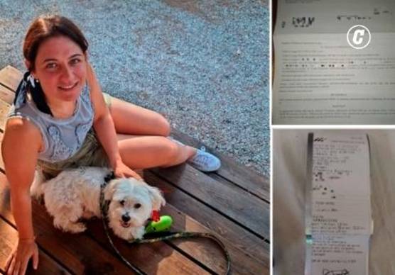 Eleonora Berretti con il cane e i documenti relativi alla sua vicenda (Foto tratta dal Corriere della Sera)